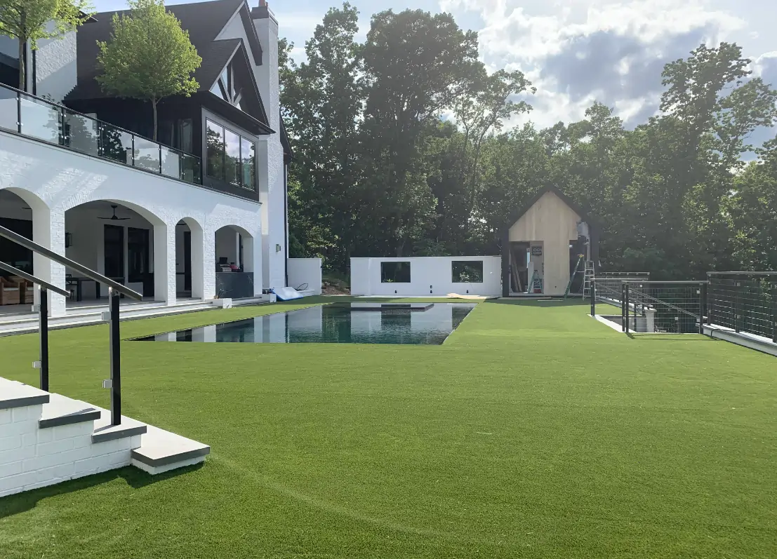 residential home pool with artificial grass