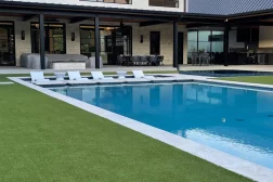 residential home pool with artificial grass